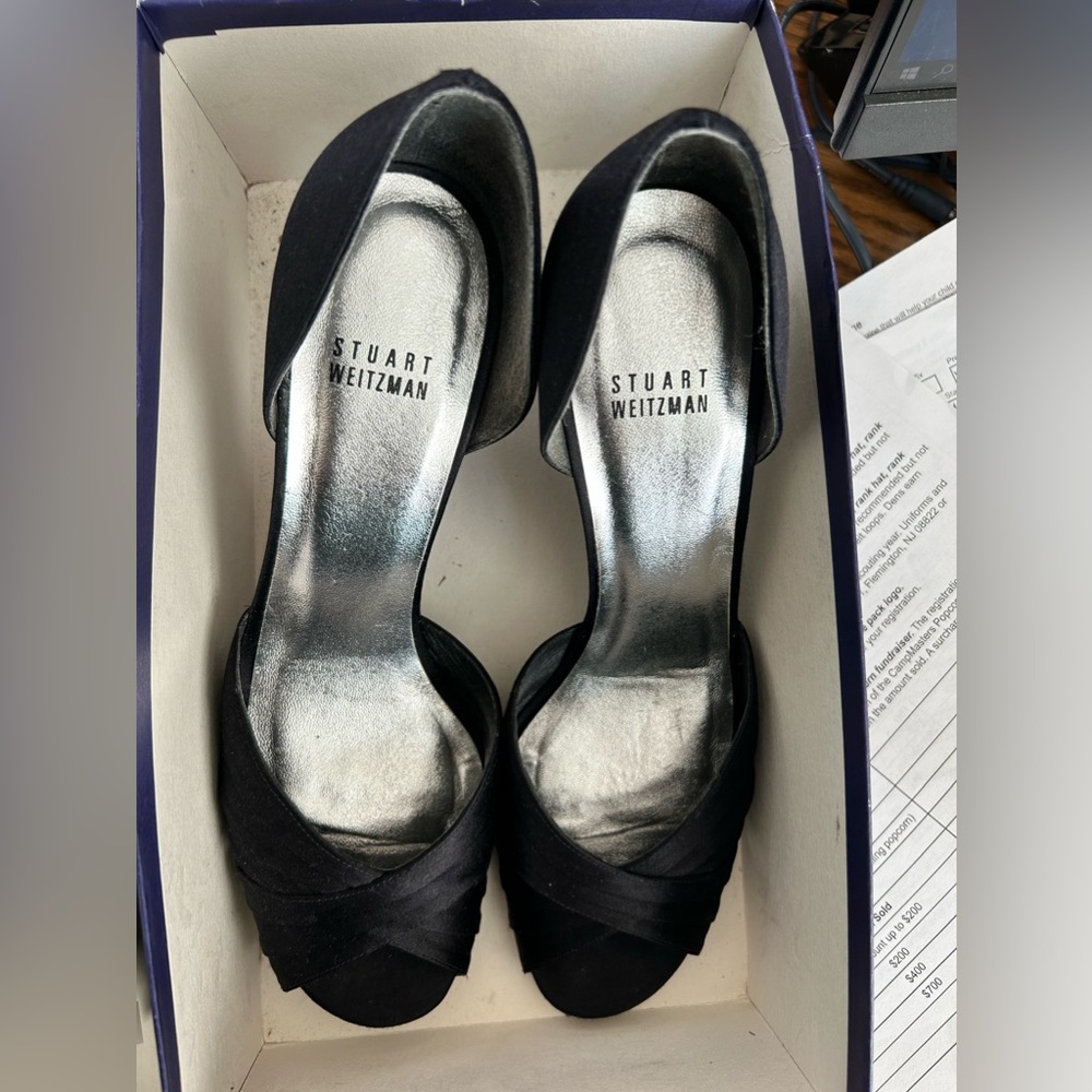 Stuart Weitzman Satin D’orsay pump.